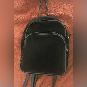 Mini black velvet backpack purse.